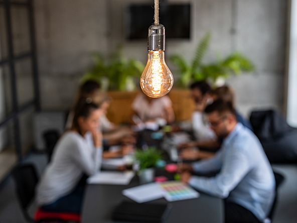 Lighbulb over business meeting